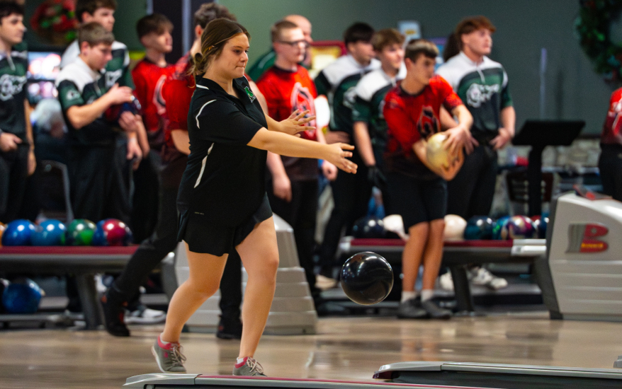 girl releasing bowling ball